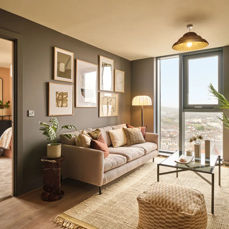 Tai Afon - 3 bedroom open plan living area featuring hardwood flooring and floor to cieling windows